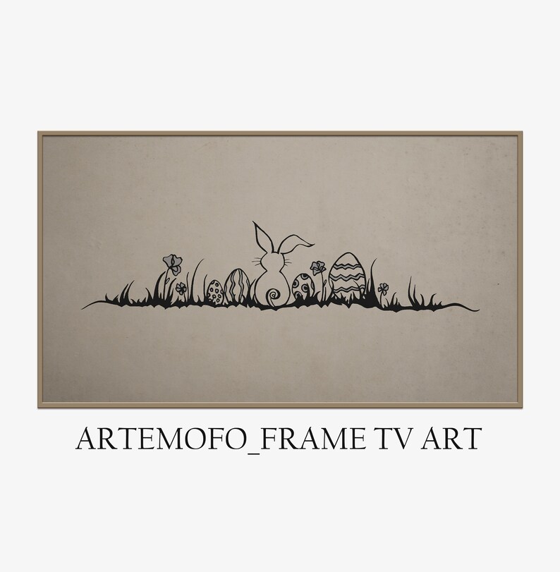 May include: A framed artwork featuring a black silhouette of an Easter bunny, eggs, and flowers on a beige background. The artwork is framed in a light brown border. The text "ARTEMOFO_FRAME TV ART" is at the bottom.