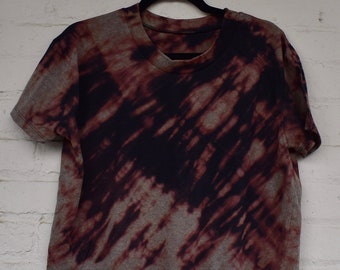 May include: A brown and black tie-dye cropped t-shirt with a relaxed fit.