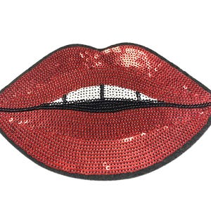 May include: Red sequin lips patch with a black outline. The patch is made of sequins and has a shiny finish.