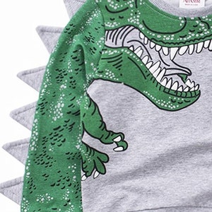 t rex looking dinosaur with spikes