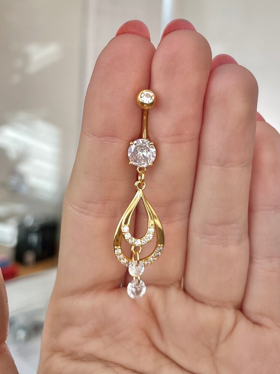 Surgical Steel Floating Gem within a Caged Star Dangling Belly Button Navel Ring Surgical Steel Floating Gem within a Caged Star Dangling Belly Button Navel Ring