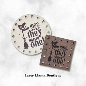 May include: Two laser-cut wooden signs featuring a witch's hat and broom design. The text on the signs reads "In 1692, they missed one!"