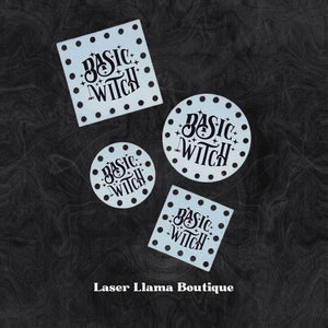 May include: Four blue laser cut stencils with the text "Basic Witch" in black lettering. The stencils are in the shape of a square and circle. The text is in a decorative font. The stencils are on a black background. Laser Llama Boutique is written in white text at the bottom of the image.