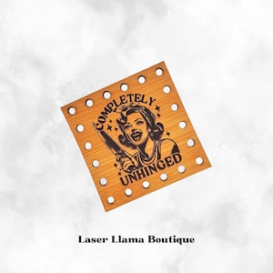 May include: A wooden coaster featuring a laser-engraved design of a woman holding a knife with the text "COMPLETELY UNHINGED".