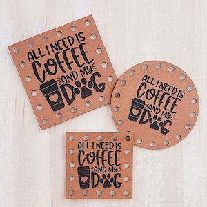 May include: Three brown wooden coasters with a black design that says "All I need is coffee and my dog" with a coffee cup and paw print.