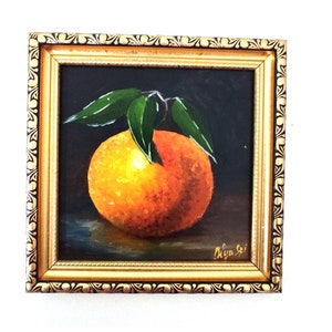 Citrus Painting. A captivating still life of bright citrus fruits, elegantly framed in gold.