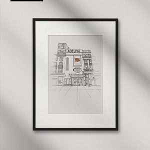 May include: A black and white line drawing of the Adelphi Theatre in London, England. The theatre is a historic building with a large sign that reads "Adelphi Theatre".