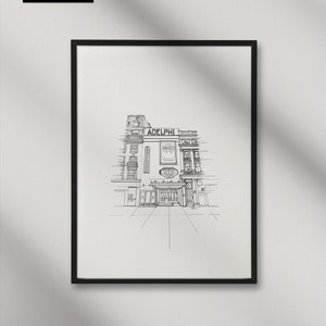 Puede incluir: Un dibujo en blanco y negro de la l&iacute;nea del Teatro Adelphi en Londres, Inglaterra. El dibujo muestra la parte delantera del teatro, con el nombre "Adelphi" sobre la entrada. El dibujo est&aacute; enmarcado en un marco negro.