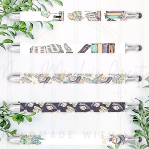 May include: Five different stylus pens with a book theme. Each pen has a different design featuring books, feathers, and other bookish elements. The pens are white with silver accents and have a black rubber tip.