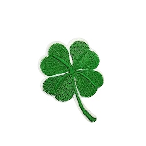 May include: A green four-leaf clover embroidered patch.
