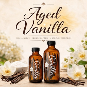 May include: Two amber glass bottles filled with dark vanilla beans, labeled with the word Vanilla and a small white flower icon. The text Aged Vanilla, Small Batch, Handcrafted, Aged to Perfection is printed above the bottles.