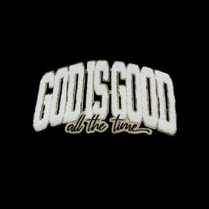 May include: White embroidered patch with the text "GOD IS GOOD all the time" in black lettering.