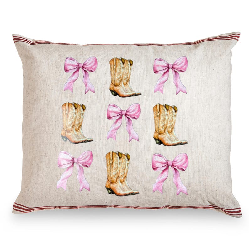 May include: A decorative pillow with a cream-colored background featuring a pattern of pink bows and cowboy boots. The boots are tan with intricate detailing. The pillow has a red striped border.