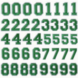 May include: Set of ten green felt iron-on numbers, each number is repeated five times. The numbers are outlined in white.