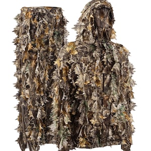 May include: A camouflage hunting suit with a hood and a matching ghillie suit. The suit is made of a brown, green, and tan fabric with a leafy pattern.