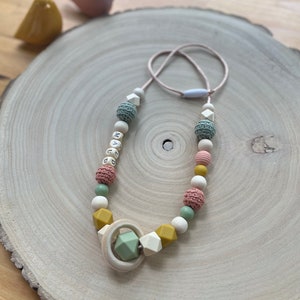 Personalized nursing or baby carrier necklace in eucalyptus green, terra cotta, and mustard