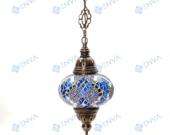 May include: A blue and white mosaic glass pendant light with a brass chain and fixture. The light has a round, slightly oval shape.