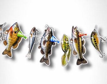 May include: A decorative garland featuring a series of illustrated fish and fishing lures strung together on a white cord. Several of the fish are wearing small, colorful, cone-shaped party hats in green, blue, and red striped patterns.
