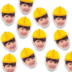 May include: A set of 12 yellow construction worker hats with a smiling boy's face on each one.