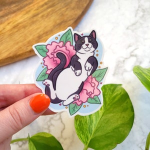 Sticker vinyle brillant 3"x2,5" Rolling Tuxie - Chat smoking, fleurs de pivoine