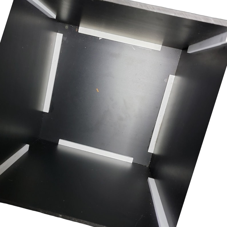 May include: An empty black box with white foam lining the inside of the box. The box is open and the inside is visible.