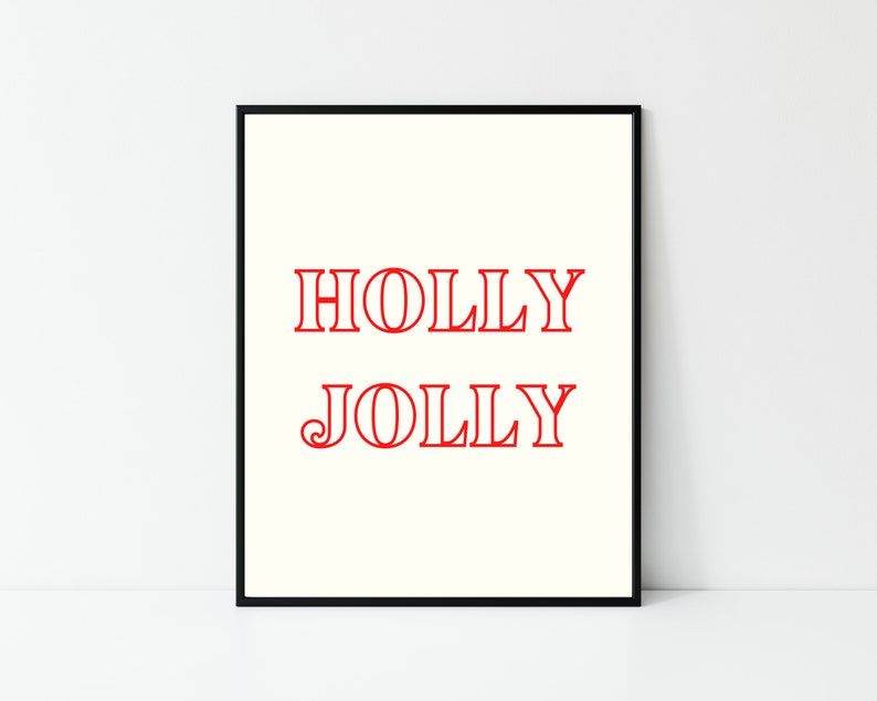 May include: A black framed print with the words "HOLLY JOLLY" in red text on a white background.