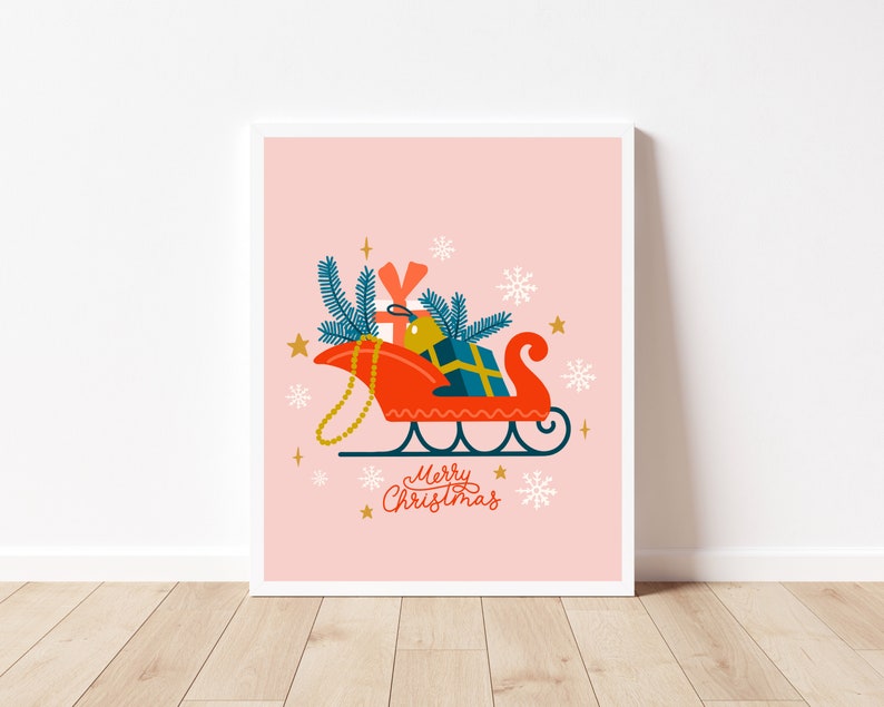 May include: A red and white sleigh filled with presents, a blue and green pine branch, and a gold star. The sleigh is on a pink background with snowflakes and the text "Merry Christmas".