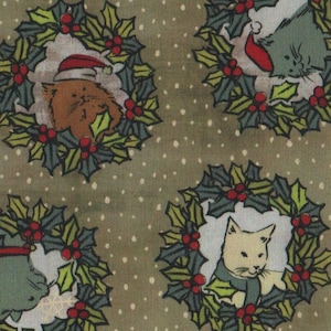 May include: A fabric pattern featuring cats inside Christmas wreaths on a muted green backdrop. The cats are in shades of grey, tan, and cream, some with festive scarves and Santa hats. The wreaths are decorated with green leaves and red berries.