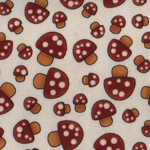May include: A white fabric with a repeating pattern of brown mushrooms with white dots. The mushrooms are all the same size and shape.
