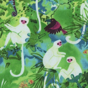 May include: A fabric print featuring a vibrant green jungle scene with white monkeys, purple birds, small butterflies, and green chameleons. The pattern includes lush foliage and blue watercolor accents scattered throughout the dense tropical design.