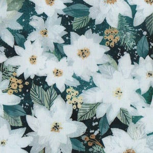 May include: A fabric with a floral pattern featuring white poinsettias with yellow centres, green leaves, and small yellow berries on a dark teal background. The design is a repeating pattern of the flowers and foliage.
