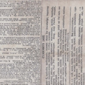 May include: A close-up of a page from a vintage dictionary with the word "CURIOSITY" highlighted. The definition of curiosity is provided in a column on the right side of the page. The text is printed in black ink on a cream-coloured background.
