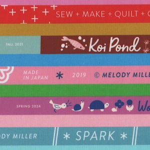 May include: A patterned fabric design with multiple horizontal bands of varying colours. The bands contain text such as "you are my favorite", "Koi Pond", and "Woodland Paint". Other bands display the text "FALL 2023", "2019", and "MELODY MILLER".