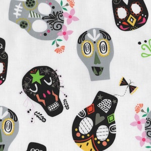 May include: White fabric with a repeating pattern of colourful sugar skulls. The skulls are decorated with black, white, green, pink, yellow, and orange details.