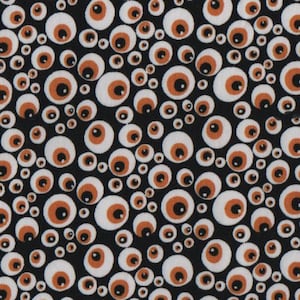 May include: A black fabric with a repeating pattern of white and orange googly eyes of various sizes.