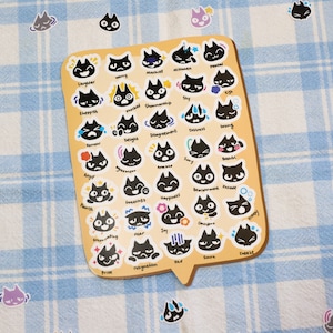 May include: A sheet of black cat stickers with different facial expressions. The expressions include laughter, worry, mischief, nervousness, shy, big, sheepish, excited, showmanship, sorrow, delight, disagreement, distress, daring, angry, annoyance, home, sorry, beautiful, flourish, greetings, happiness, smiling, fear, joy, enjoying, pride, resignation, sad, smirk, surprise.
