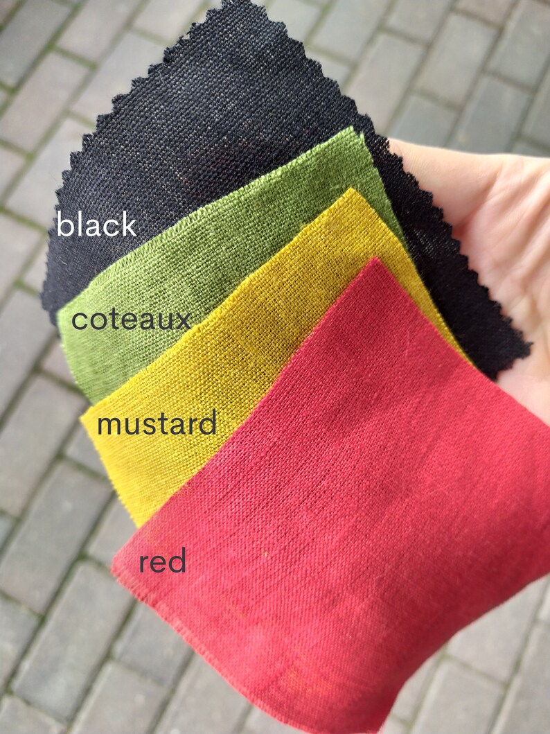 May include: Four fabric swatches in different colors: black, green, yellow, and red. The swatches are labeled "black", "coteaux", "mustard", and "red".