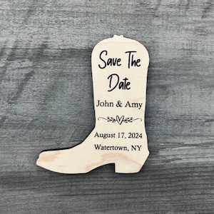 May include: Wooden boot-shaped save the date card with the text "Save The Date", "John & Amy", "August 17, 2024", and "Watertown, NY".