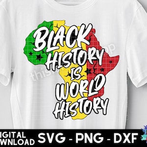 May include: A white t-shirt with a graphic design of a yellow, red, and green outline of Africa. The text "Black History is World History" is written in black letters on the graphic.