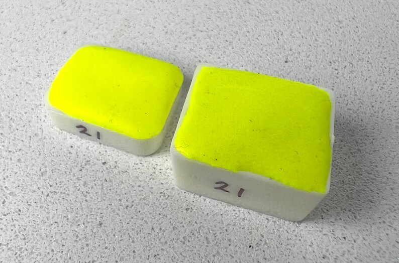 May include: Two bright yellow paint squares, both labelled with the number "21".