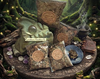 May include: Four clear plastic bags filled with dried herbs and botanical blends, each featuring a round tan label with text including Purification, Protection, and Banishment. A small cauldron, a crystal sphere, and a leather-bound book are present.