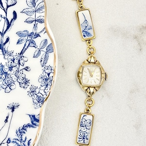 Vintage MANUAL Clinton Gold Broken China Watch with Blue Hummingbirds image 1