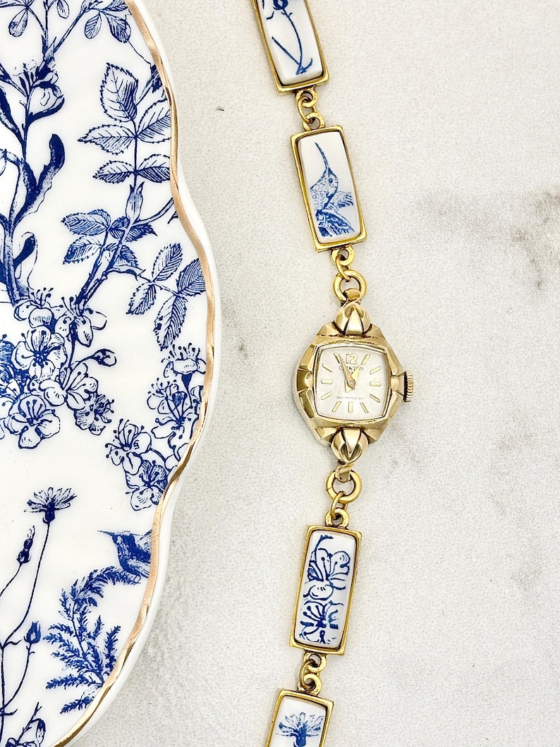 Vintage MANUAL Clinton Gold Broken China Watch with Blue Hummingbirds image 1