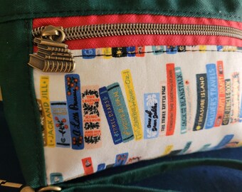 Waxed Canvas Wristlet: Zipper Pockets, Our Lady of Guadalupe, Floral, Books