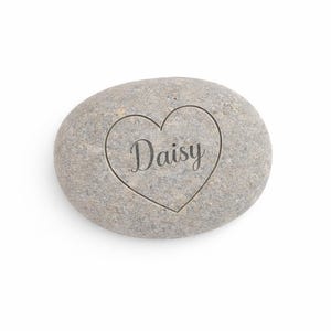 Personalised engraved stone with name Daisy inside heart design, clean product image on white background