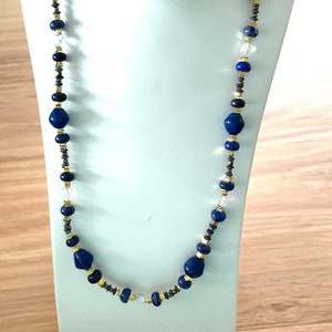 139. Paper, Lapis Lazuli stone beaded necklace.