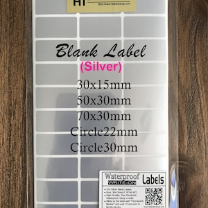 May include: A sheet of 210 silver blank labels in various sizes, including 30x15mm, 50x30mm, 70x30mm, and circles with diameters of 22mm and 30mm. The labels are waterproof and tear-resistant, making them ideal for labeling and organizing.