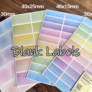 May include: Four sheets of blank labels with a rainbow gradient design. The labels are in different sizes: 30mm circle, 45x25mm, 46x15mm, and 30x15mm. The labels are waterproof and write-on. The text "Waterproof WRITE-ON Label Stickers 120 Stickers" is printed on the bottom right sheet.