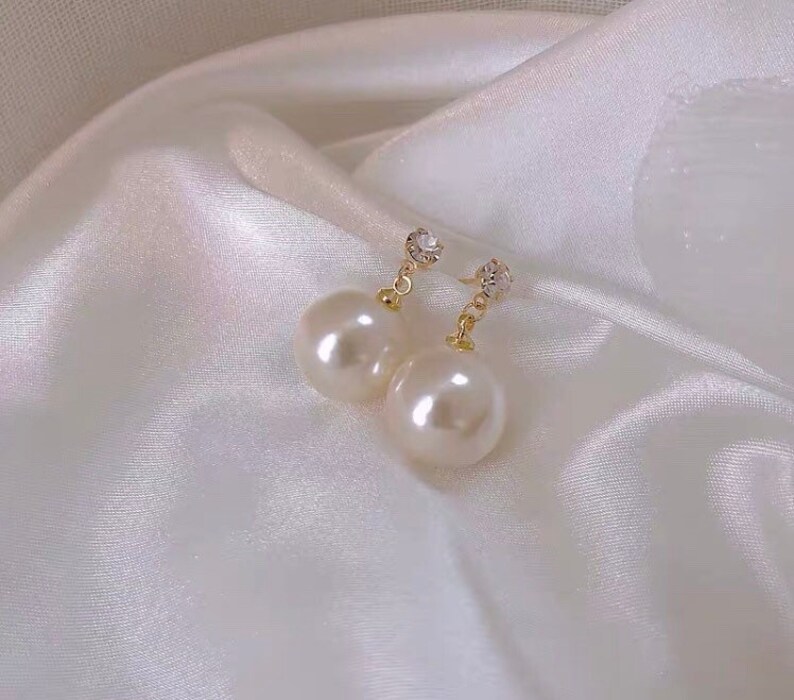Large pearl earrings