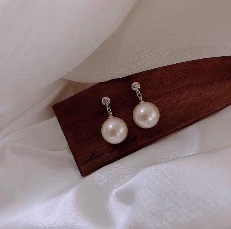 Large pearl earrings